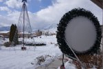 DSC00389 The mega wreath from the rear.  It has unistrut re-enforcement for our winds.  The screen is held in place with ball bungees.