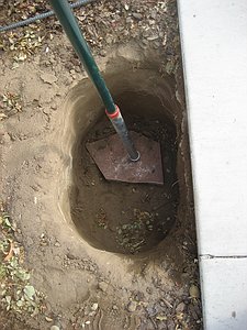 Post in hole sitting on flagstone